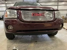 02-09 Gmc Envoy Front Bumper Assm With Lights And Rebar 49U Cranberry Red. Fixed Price $200.00.