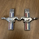 Preowned 68 Mustang 289 Fender Emblems C8ZZ-16228-A Pair #2. Fixed Price $50.00.