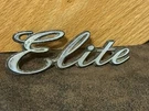 Oem Ford Elite Emblem Metal Script Badge # D50B-16702-AA Used With Pins. Fixed Price $9.99.