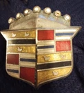 ++ 1970'S Cadillac Hood Crest Emblem - Cloisonne Enamel Post 3" X 2 1/8". Fixed Price $35.00.