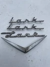 1959 - 1961 Studebaker Lark Fender Script Plate Emblem Ornament. Fixed Price $65.00.