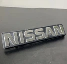 1983-1986 Nissan 720 Pickup Truck Front Grill Emblem Oem. Fixed Price $49.98.