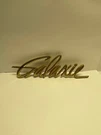 Ford 1960 Gold Galaxie Fender Emblem + Trunk Lock Bezel C0AB-16098-G. Fixed Price $34.50.