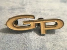 Gm 1967-68 Pontiac Grand Prix Script Gp Emblem Badge # 9784506 66218 Oem Part. Fixed Price $30.00.