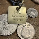 1981 De Lorean DMC-12 Brass Key Fob. Fixed Price $16.95.