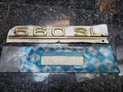 Mercedes 560SL Emblem Trunk Insignia R107 1078171415 Gold Nos Badge Oem. Fixed Price $200.00.