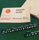 Automatic Drive Emblem For Studebaker W/ Drilling Template And Booklet. Fixed Price $90.00.